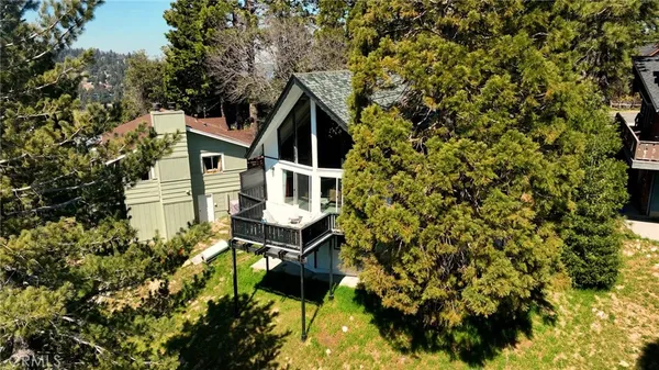 a house with trees in front of it