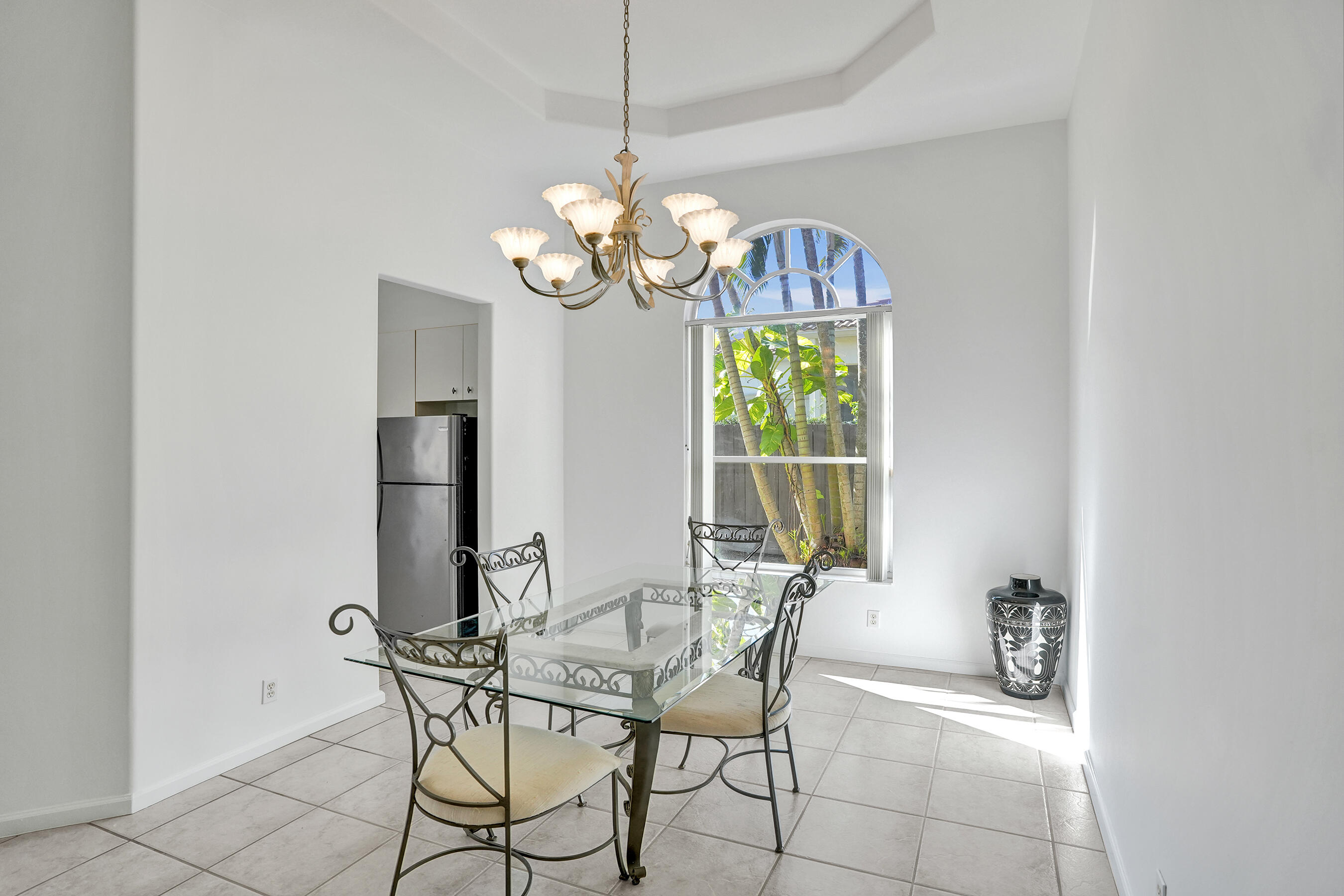 15874 Vivanco Street Delray Beach, FL 33446 - Photo 12 of 33 a view of a dining room with furniture and a chandelier