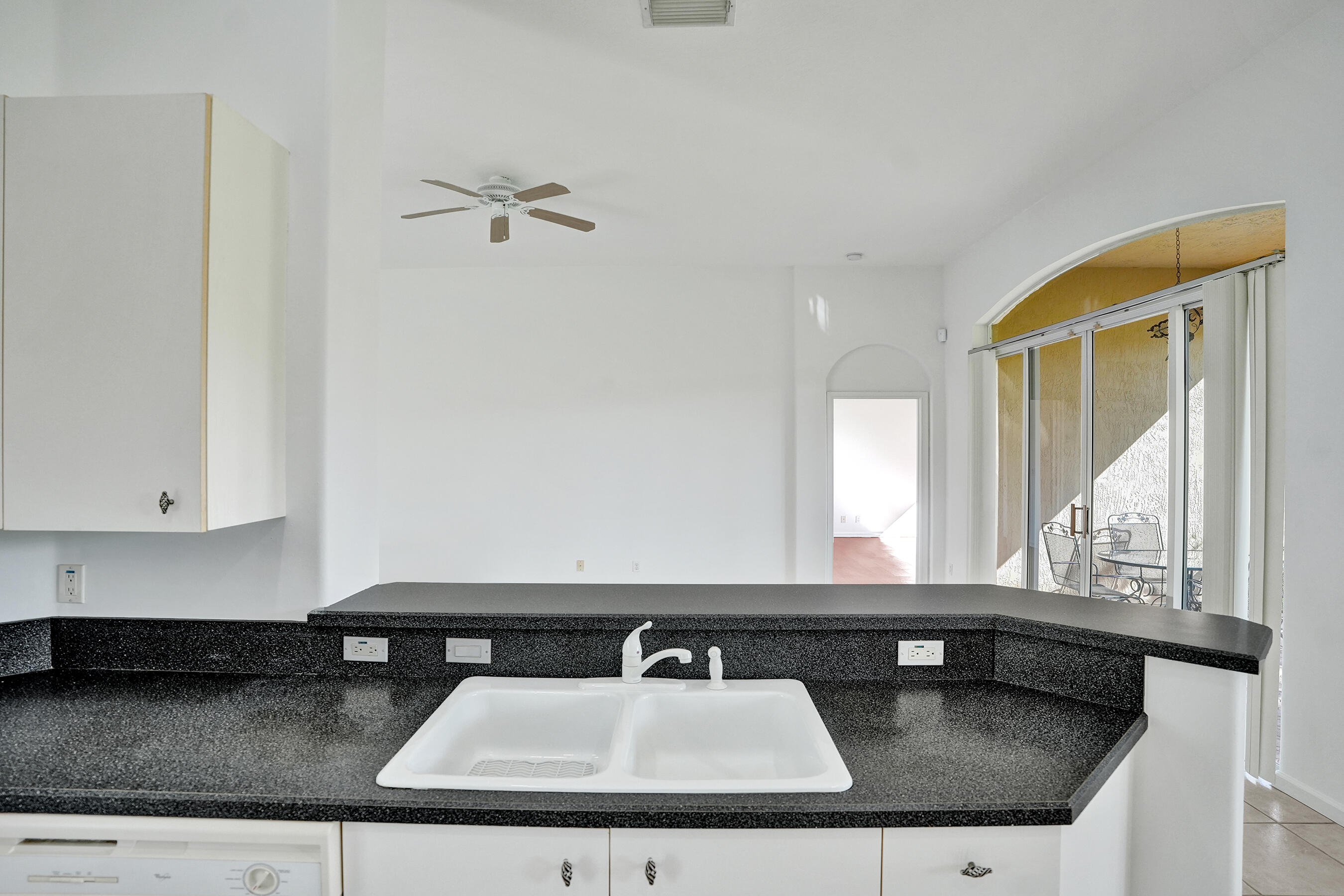 15874 Vivanco Street Delray Beach, FL 33446 - Photo 16 of 33 a bathroom with a granite countertop sink and a mirror