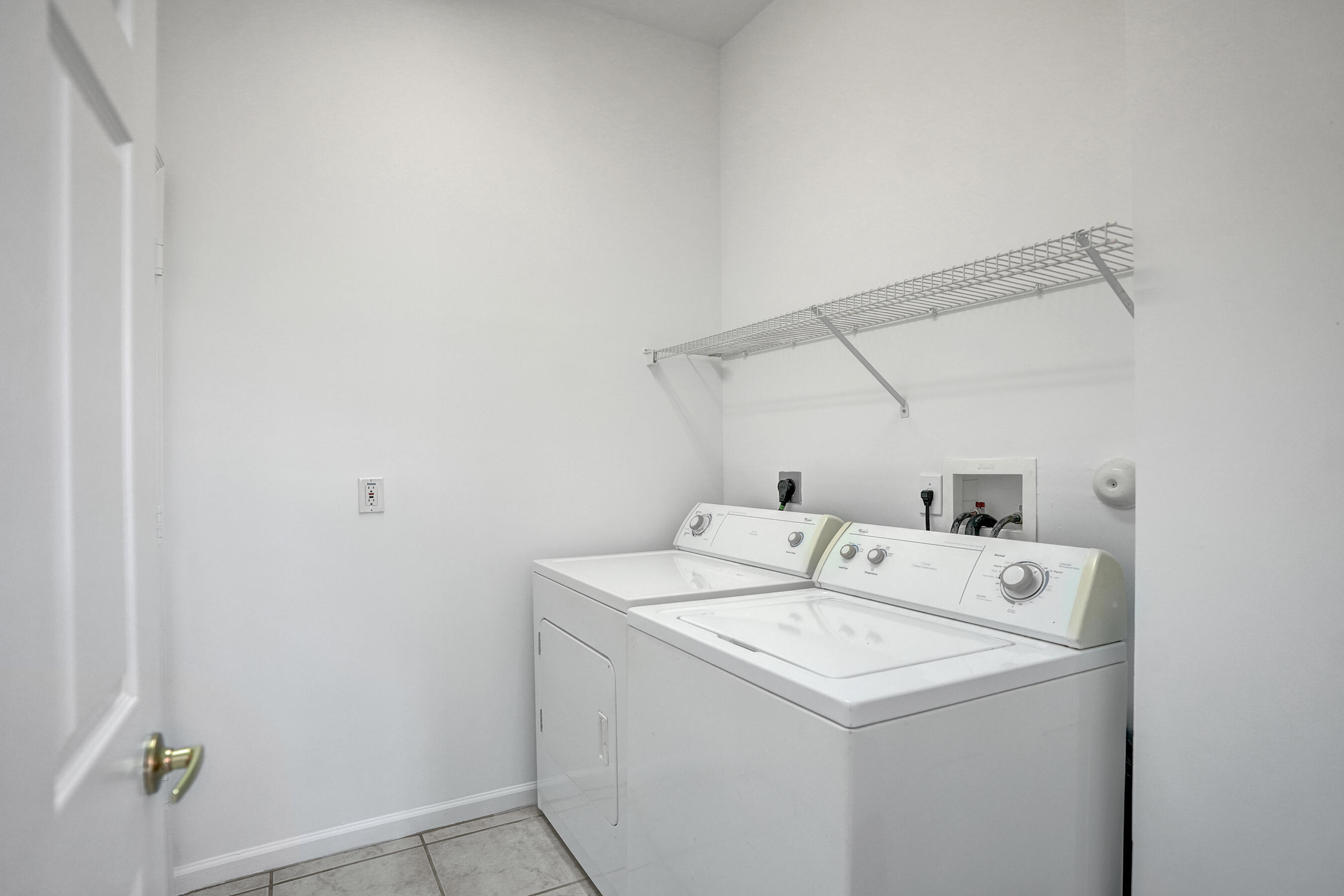 15874 Vivanco Street Delray Beach, FL 33446 - Photo 22 of 33 a utility room with dryer and washer