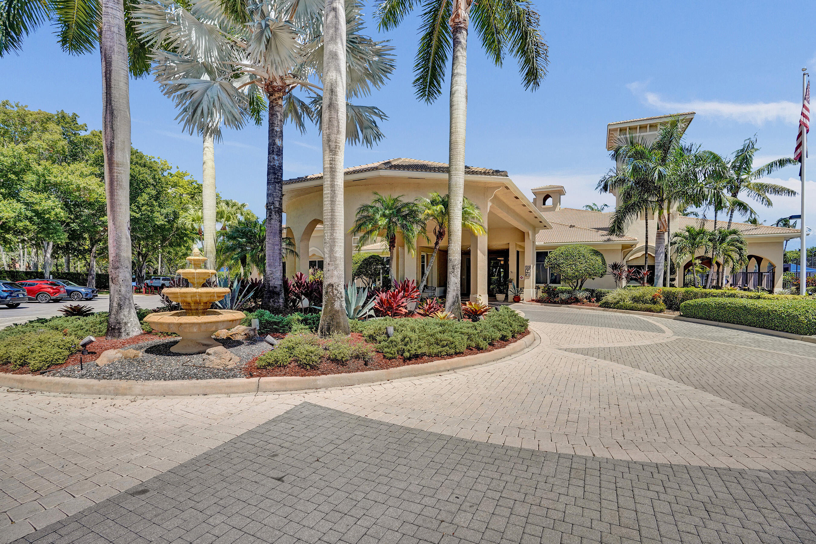 15874 Vivanco Street Delray Beach, FL 33446 - Photo 28 of 33 front view of a palm trees next to a road