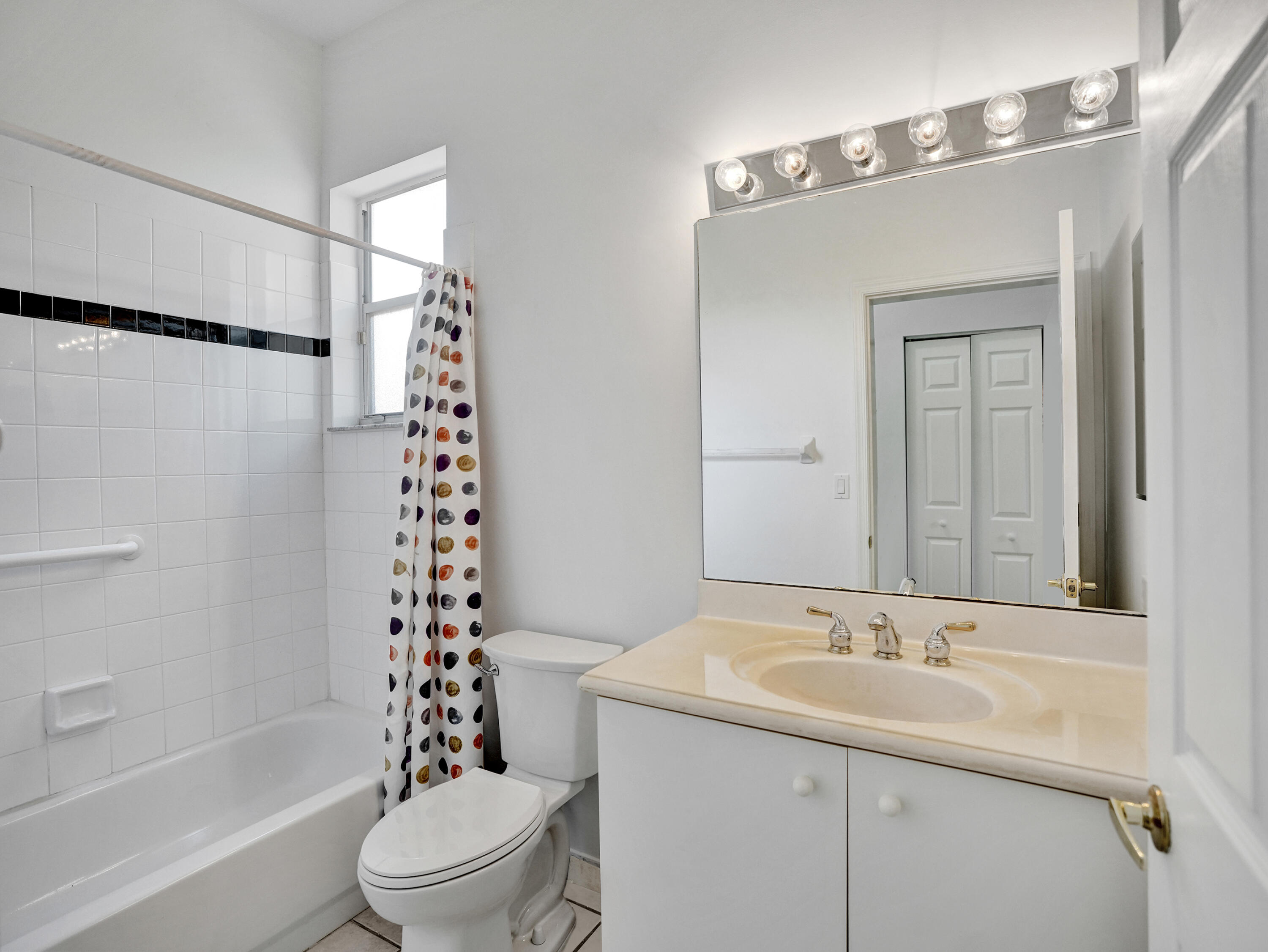 15874 Vivanco Street Delray Beach, FL 33446 - Photo 9 of 33 a bathroom with a sink toilet and shower