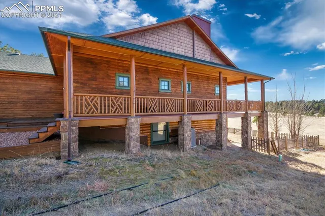 a view of a backyard with sitting area