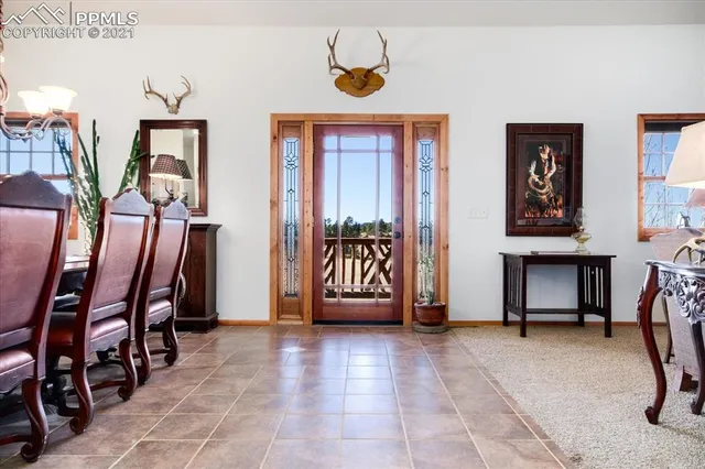 a bedroom with furniture and a large window