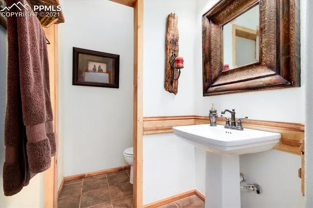 a kitchen with stainless steel appliances granite countertop a refrigerator and a stove