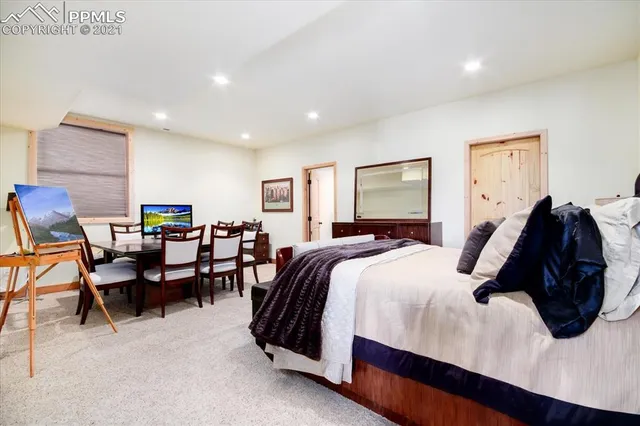 a living room with furniture a window and a flat screen tv