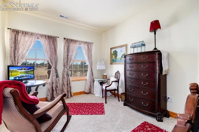 a bathroom with a granite countertop sink mirror vanity and toilet