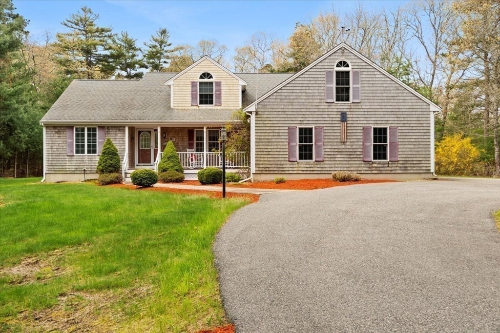 185 Great Neck Road Wareham, MA 02571 - Photo 3 of 34 a front view of a house with a yard and trees