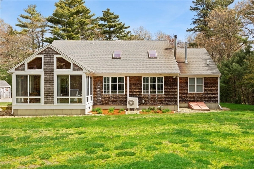 185 Great Neck Road Wareham, MA 02571 - Photo 4 of 34 a front view of a house with a yard and porch