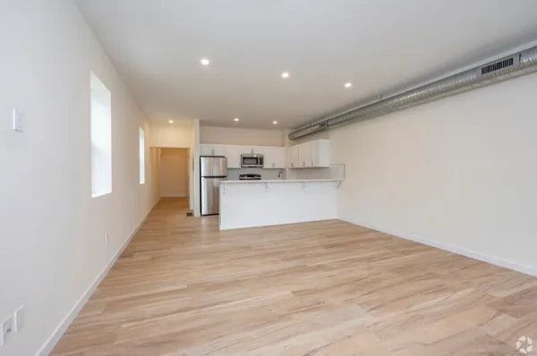 a view of kitchen with wooden floor