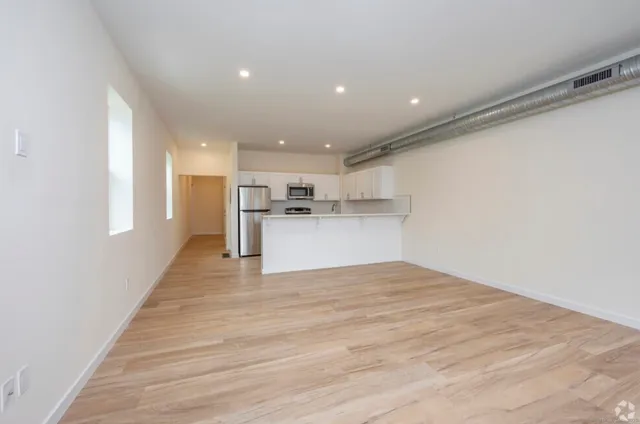 a view of kitchen with wooden floor