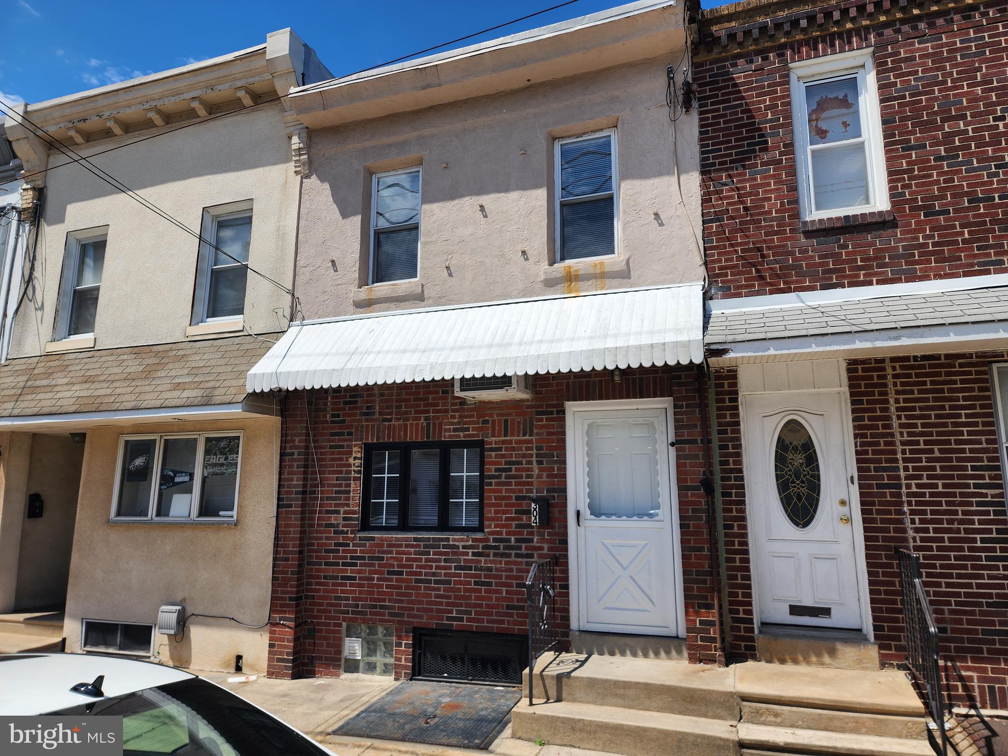 304 North 64th Street Philadelphia, PA 19139 - Photo 1 of 36 a front view of a house with a balcony