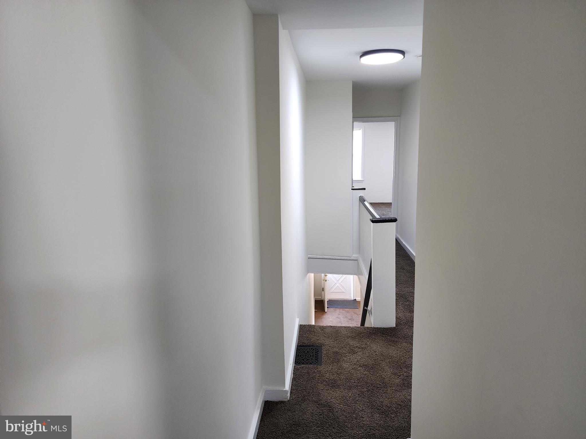 304 North 64th Street Philadelphia, PA 19139 - Photo 30 of 36 a view of a bathroom from a corridor