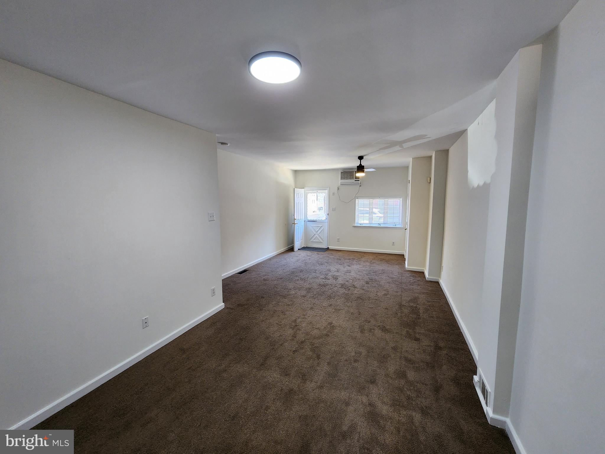 304 North 64th Street Philadelphia, PA 19139 - Photo 5 of 36 a view of livingroom and hallway with window