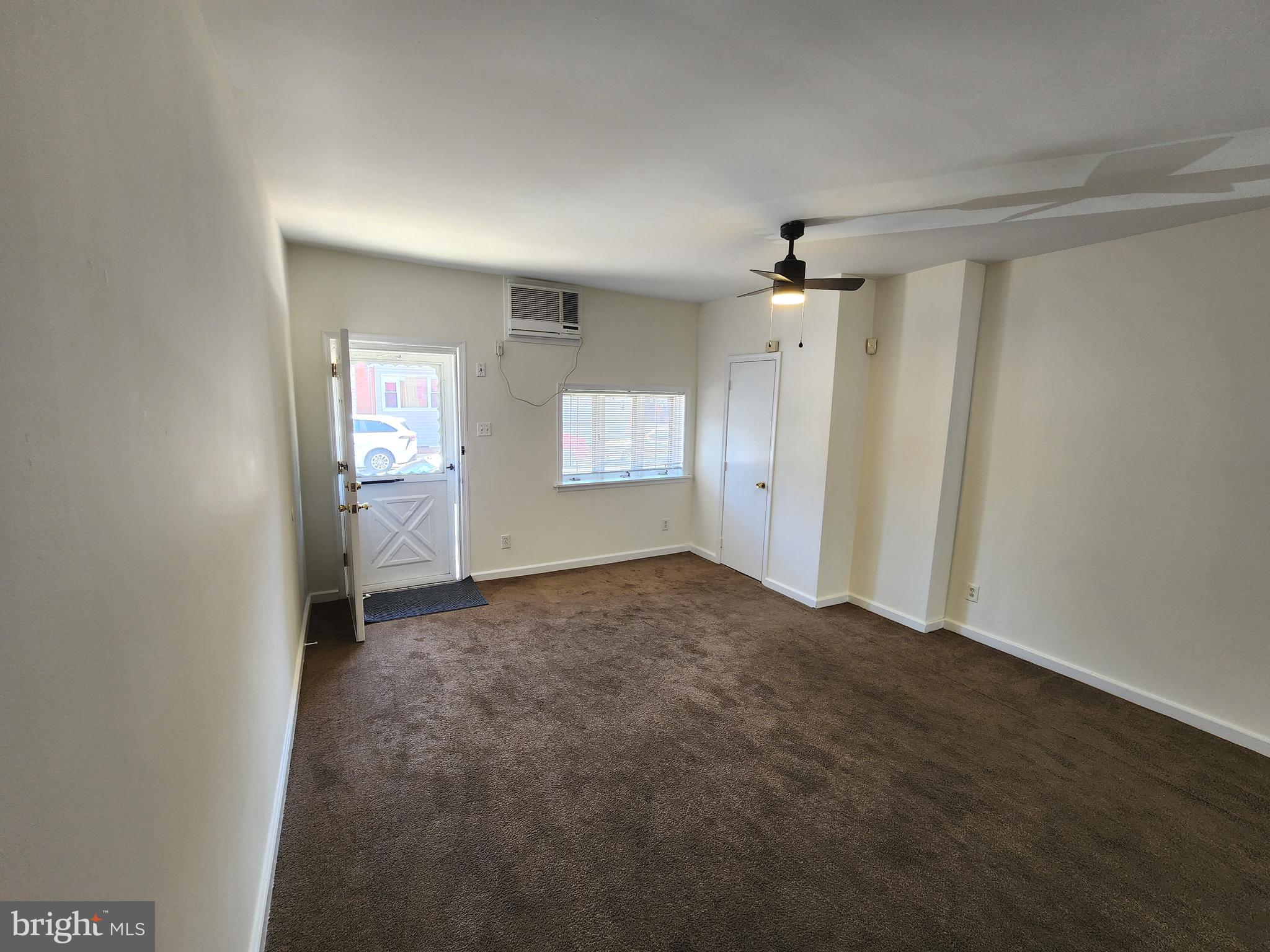 304 North 64th Street Philadelphia, PA 19139 - Photo 6 of 36 an empty room with windows and cabinet