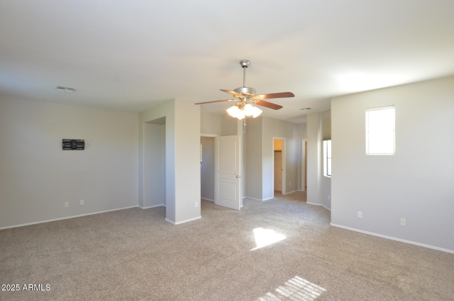 2438 West Jake Haven Phoenix, AZ 85085 - Photo 8 of 28 a view of a chandelier fan and entryway