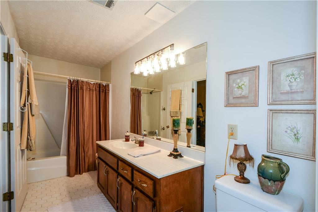 130 Hawn Road Fayetteville, GA 30215 - Photo 31 of 67 a bathroom with a sink double vanity and a mirror