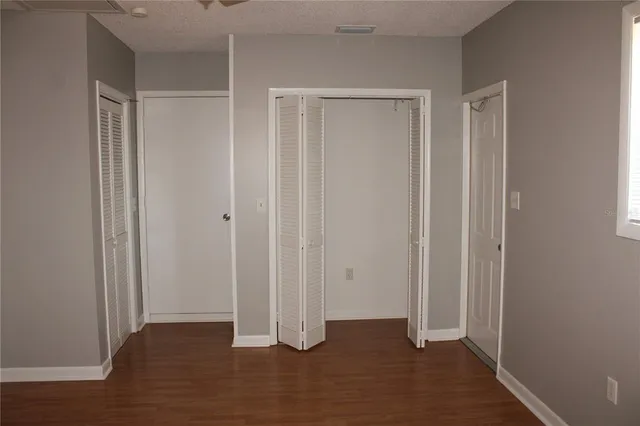 a view of entryway with wooden floor