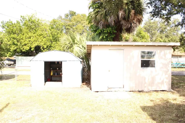 a view of a backyard of the house