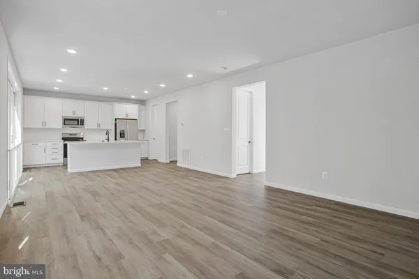 a view of kitchen with wooden floor