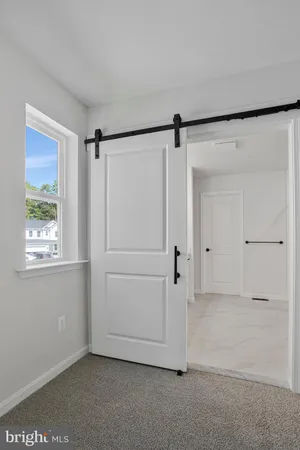 a bathroom with a double vanity sink a mirror and a shower