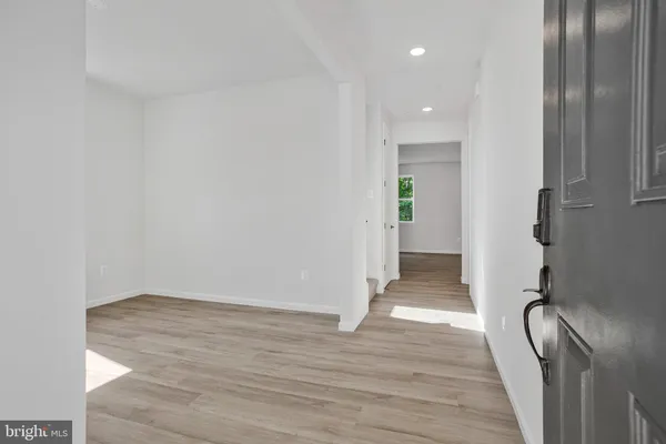 a view of entryway with wooden floor