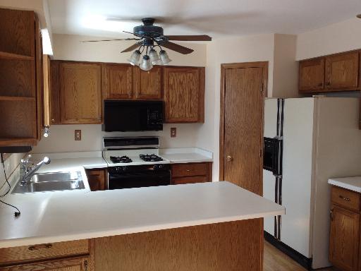 26157 West Rollins Road Ingleside, IL 60041 - Photo 3 of 10 a kitchen with stainless steel appliances a refrigerator and a stove