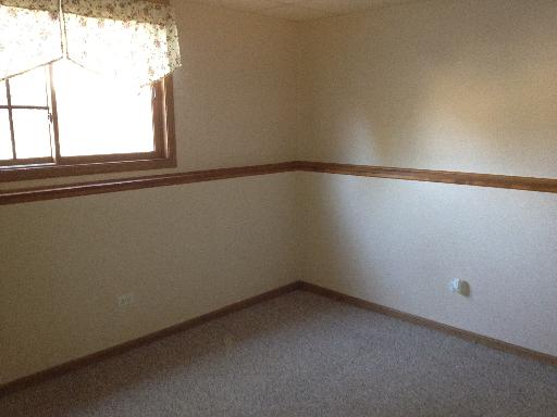 26157 West Rollins Road Ingleside, IL 60041 - Photo 5 of 10 a view of a small space with wooden floor and a window
