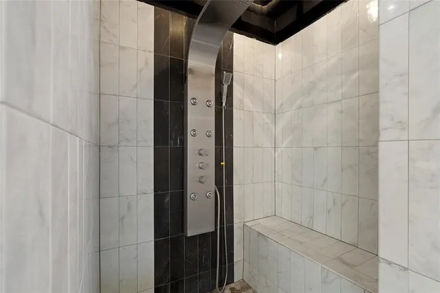 a bathroom with a shower and toilet