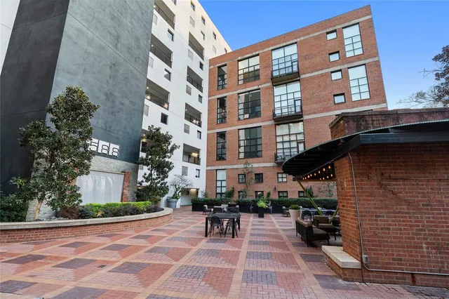 a view of front of building with outdoor seating