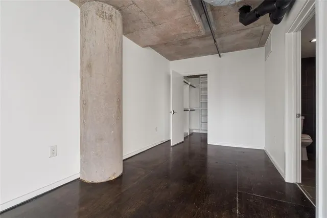 an empty room with wooden floor