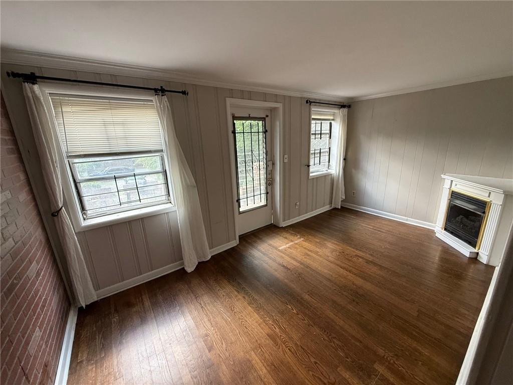 846 Briarcliff Road Northeast Atlanta, GA 30306 - Photo 17 of 22 an empty room with wooden floor and windows