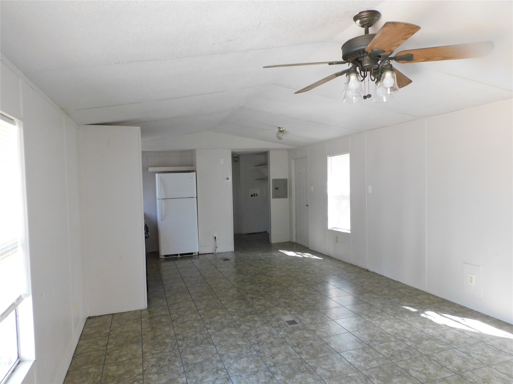 136 Bullfrog Holler Road Dale, TX 78616 - Photo 6 of 8 an empty room with a ceiling fan and window