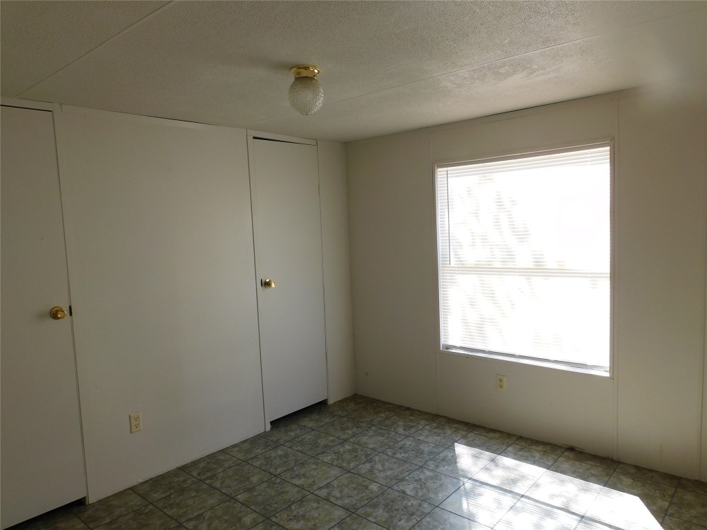 136 Bullfrog Holler Road Dale, TX 78616 - Photo 7 of 8 a view of an empty room with a window