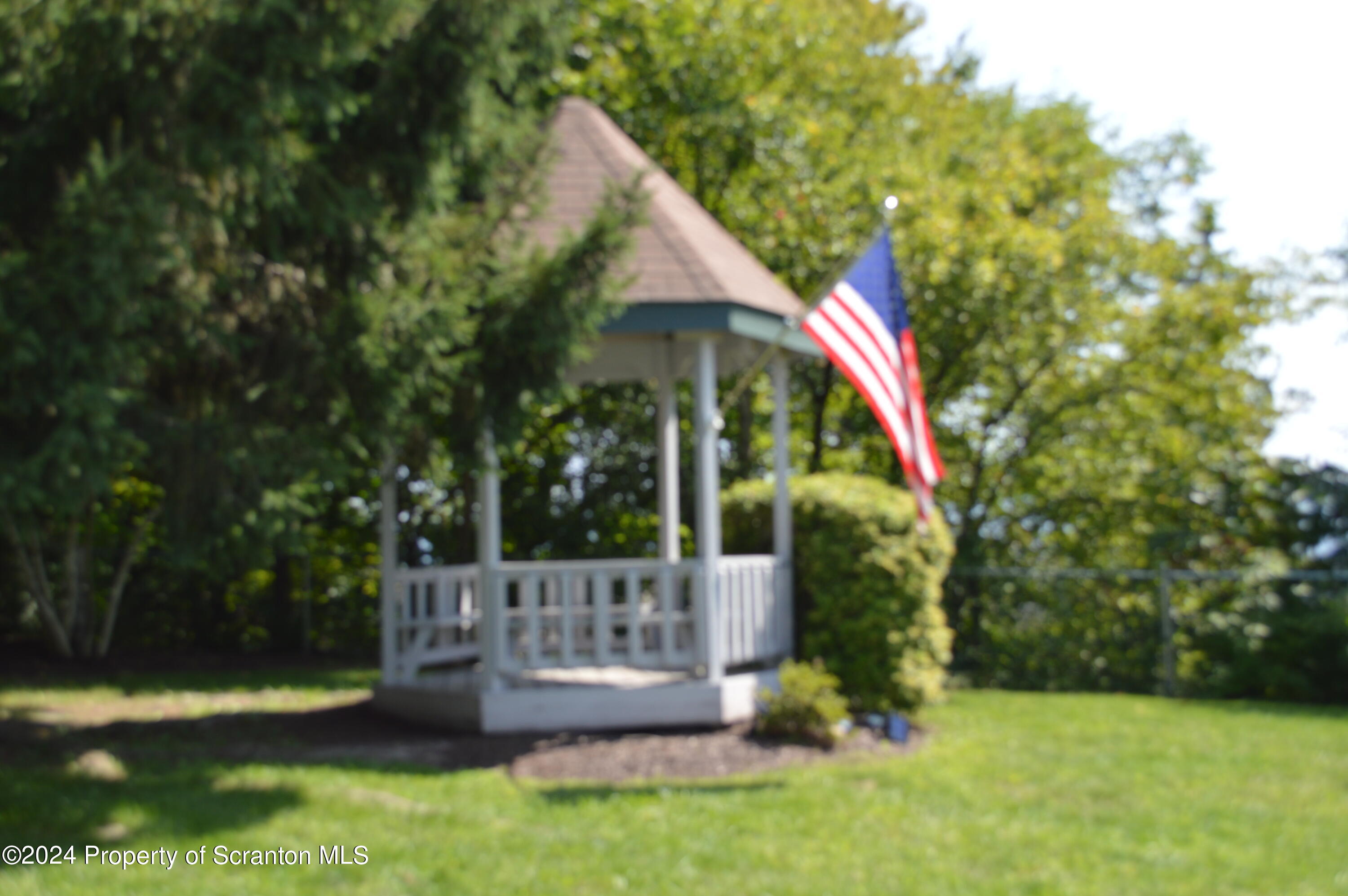 1704 Summit Pointe Scranton, PA 18508 - Photo 12 of 16 a view of house with a yard and sitting area