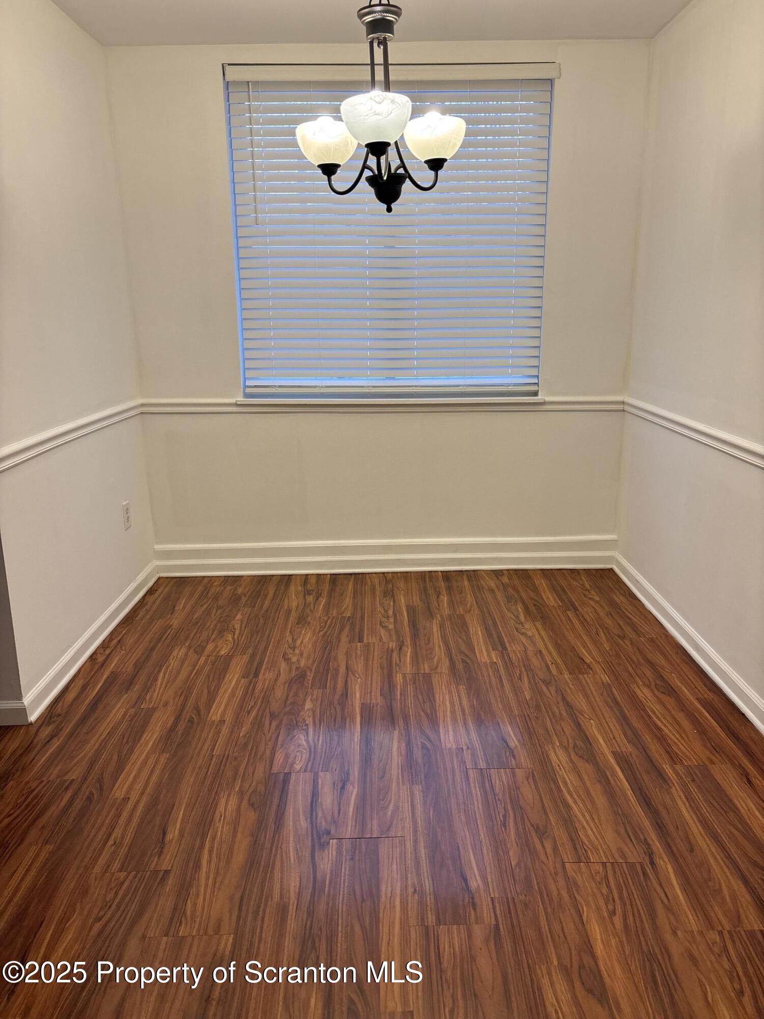 1704 Summit Pointe Scranton, PA 18508 - Photo 6 of 16 a view of a room with wooden floor