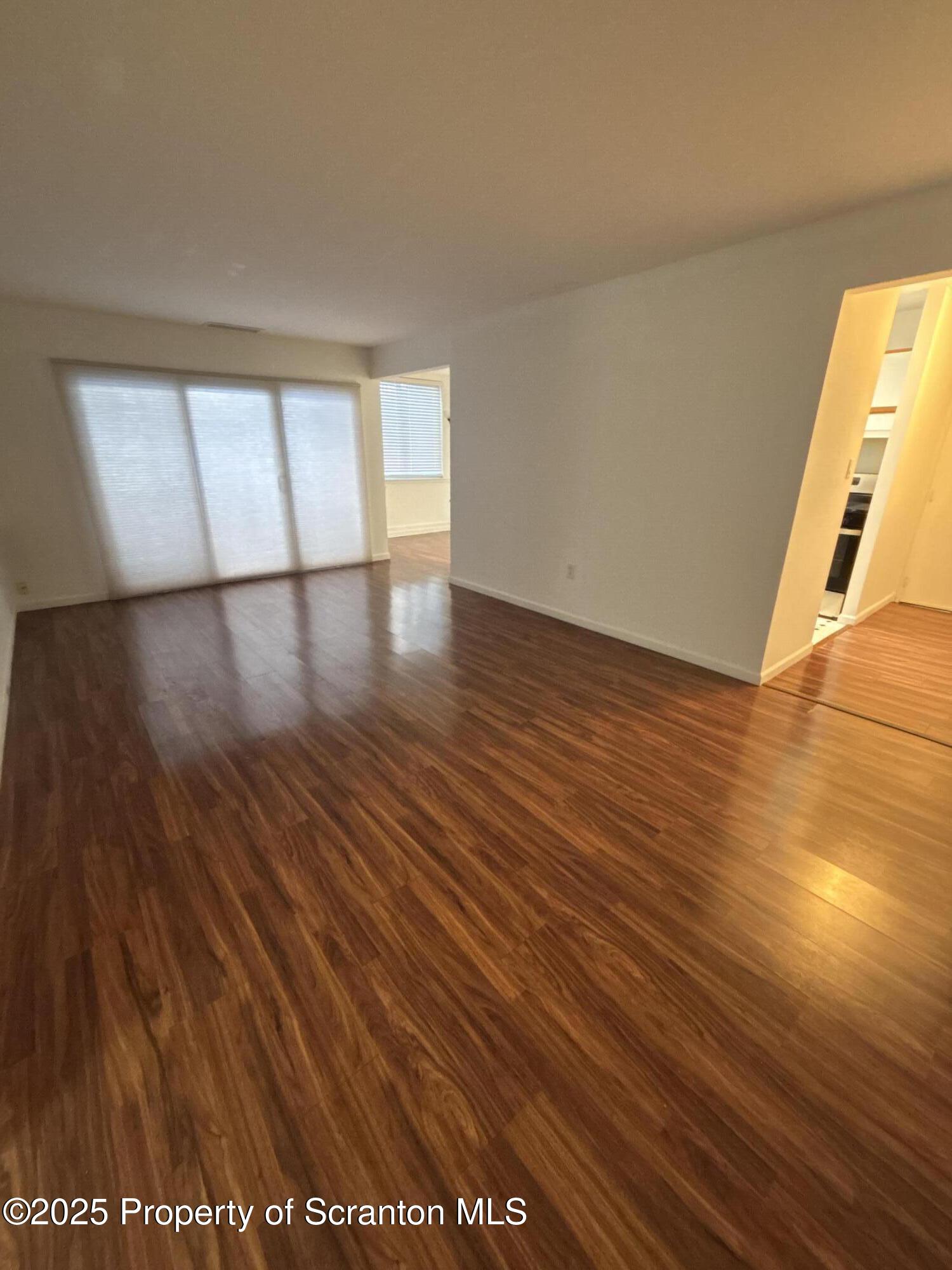 1704 Summit Pointe Scranton, PA 18508 - Photo 7 of 16 a view of a room with wooden floor