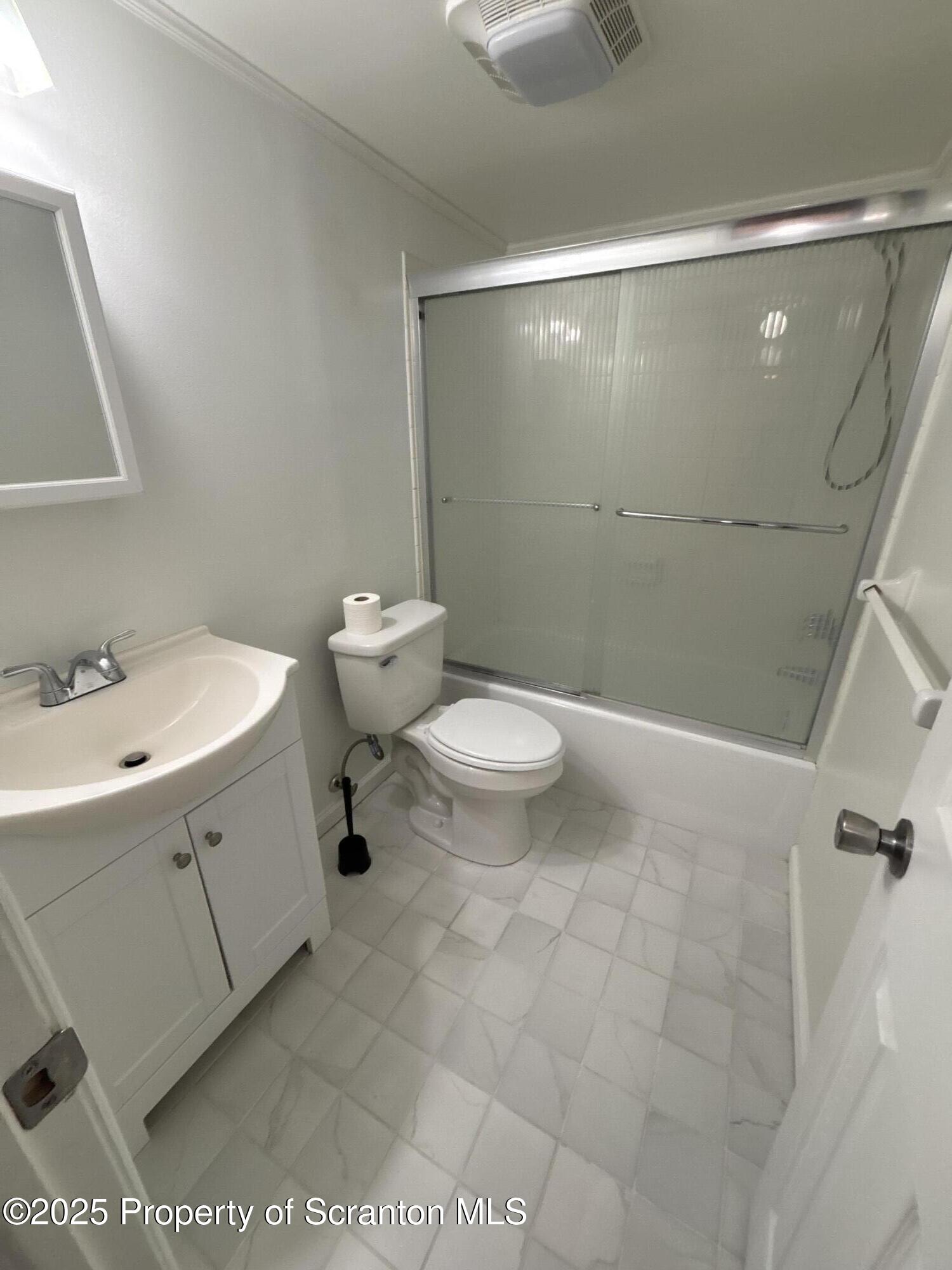 1704 Summit Pointe Scranton, PA 18508 - Photo 9 of 16 a bathroom with a sink a toilet and shower