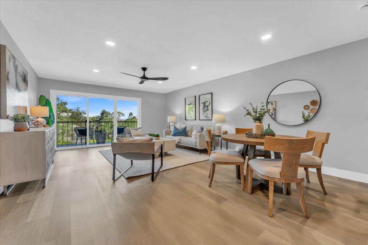 1685 Bayridge Way, Unit 204 San Mateo, CA 94402 - Photo 13 of 28 a living room with furniture a rug and a large window