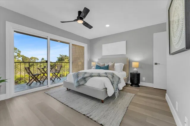 a bedroom with a large bed and a large window