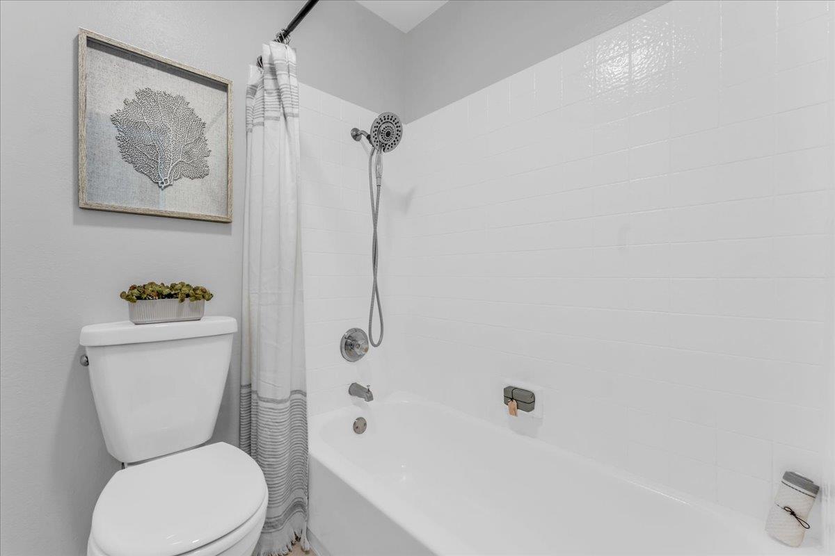 1685 Bayridge Way, Unit 204 San Mateo, CA 94402 - Photo 23 of 28 a white toilet sitting next to a bath tub shower
