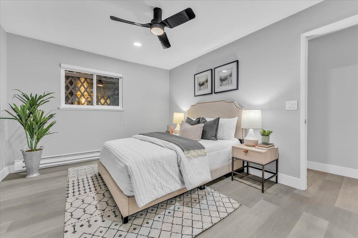 1685 Bayridge Way, Unit 204 San Mateo, CA 94402 - Photo 25 of 28 a bedroom with a bed and a painting on the wall