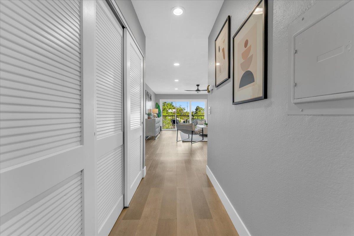 1685 Bayridge Way, Unit 204 San Mateo, CA 94402 - Photo 5 of 28 a view of a hallway with wooden floor