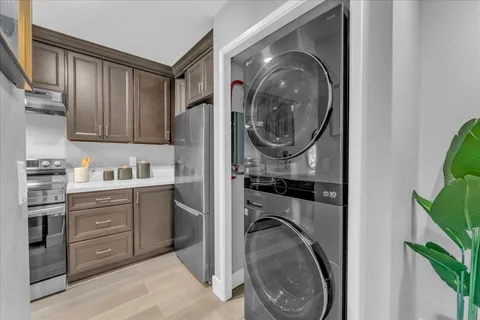a utility room with sink dryer and washer