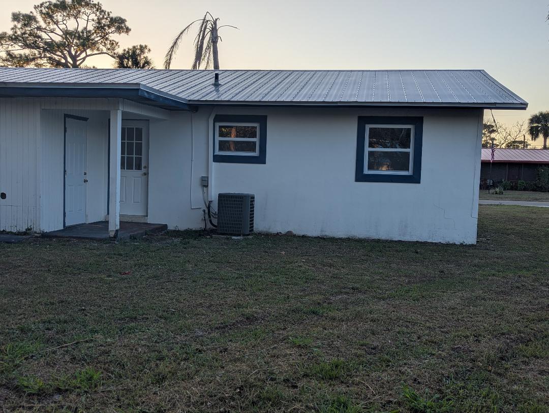 2736 Seneca Avenue Fort Pierce, FL 34946 - Photo 2 of 16 a front view of house with yard