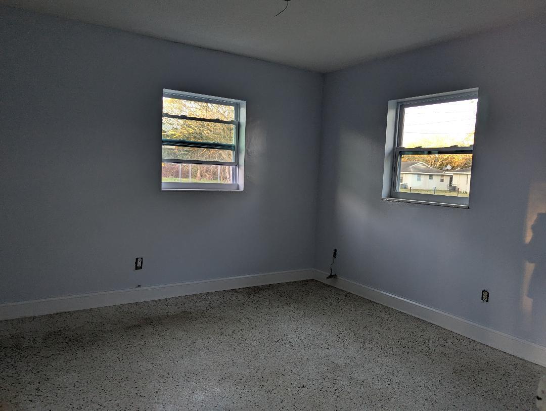 2736 Seneca Avenue Fort Pierce, FL 34946 - Photo 4 of 16 an empty room with windows