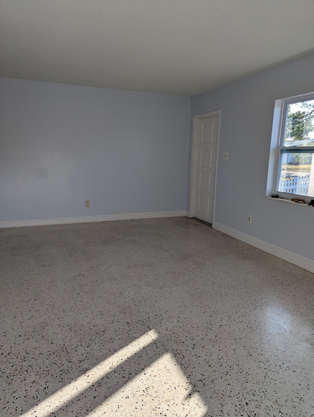 2736 Seneca Avenue Fort Pierce, FL 34946 - Photo 10 of 16 a view of wooden floor and chandelier in a room