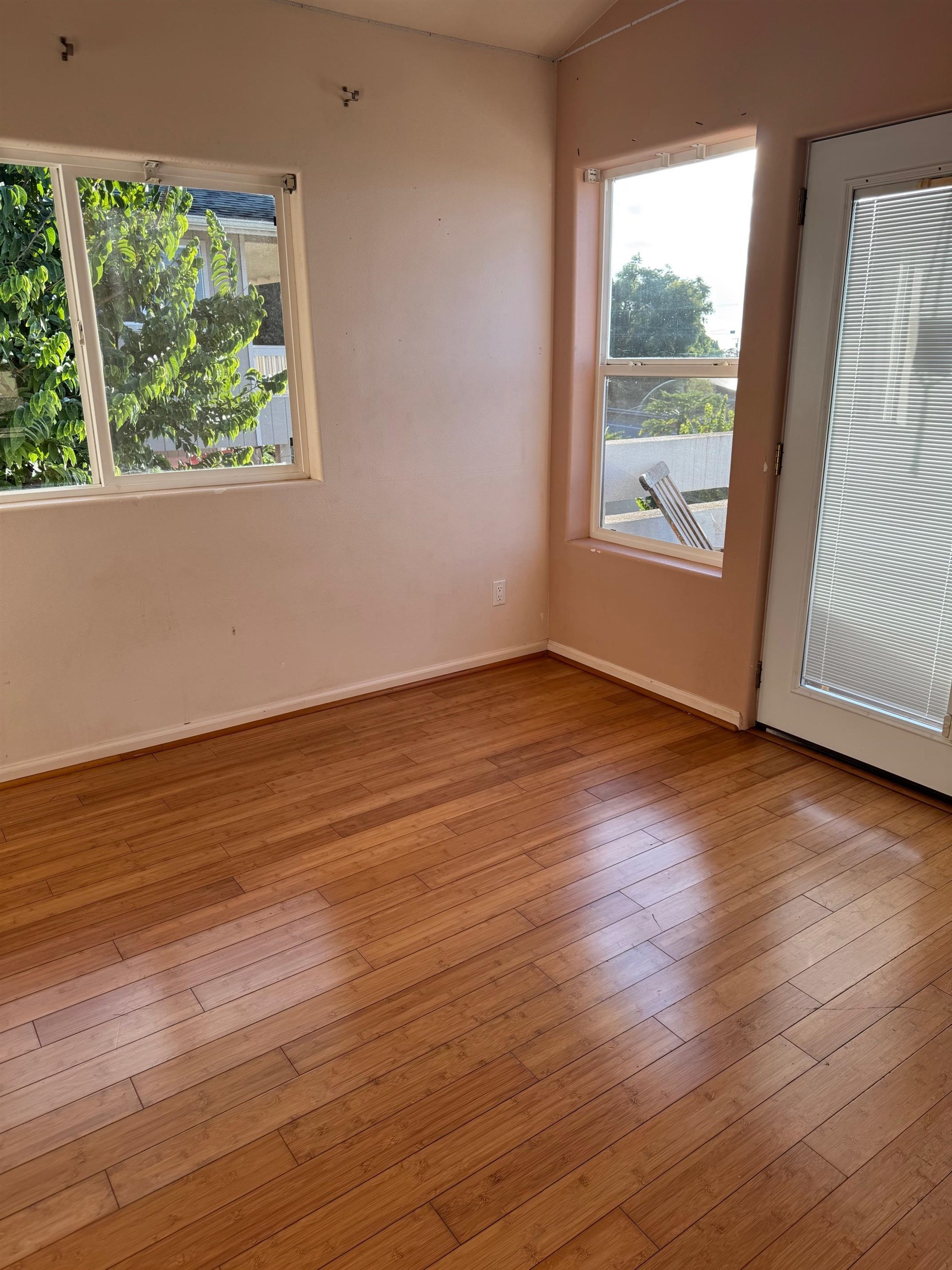 40 Kalihi Place Kula, HI 96790 - Photo 13 of 15 a view of an empty room with wooden floor and a window