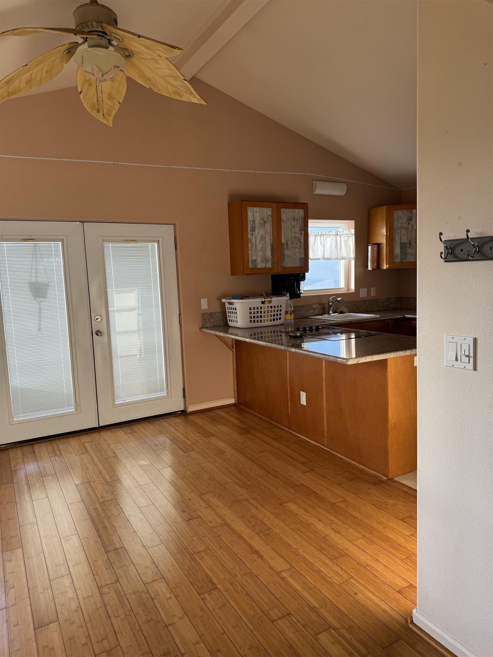40 Kalihi Place Kula, HI 96790 - Photo 14 of 15 a kitchen with stainless steel appliances granite countertop a sink and cabinets with wooden floor