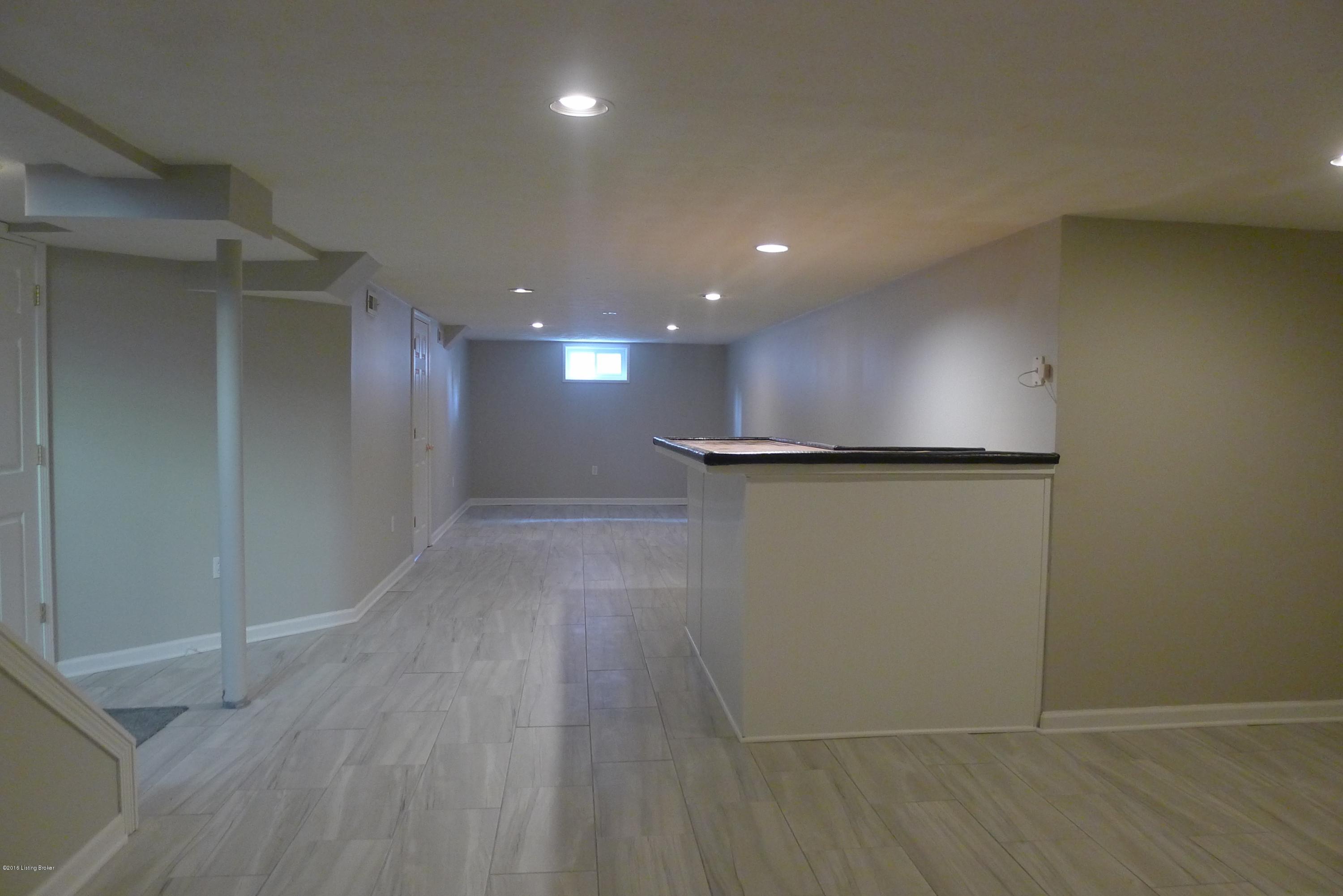 2613 Harmony Road Louisville, KY 40299 - Photo 16 of 21 Basement with bar in game room.
